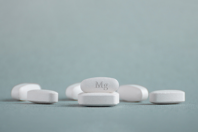 white pills labeled Mg